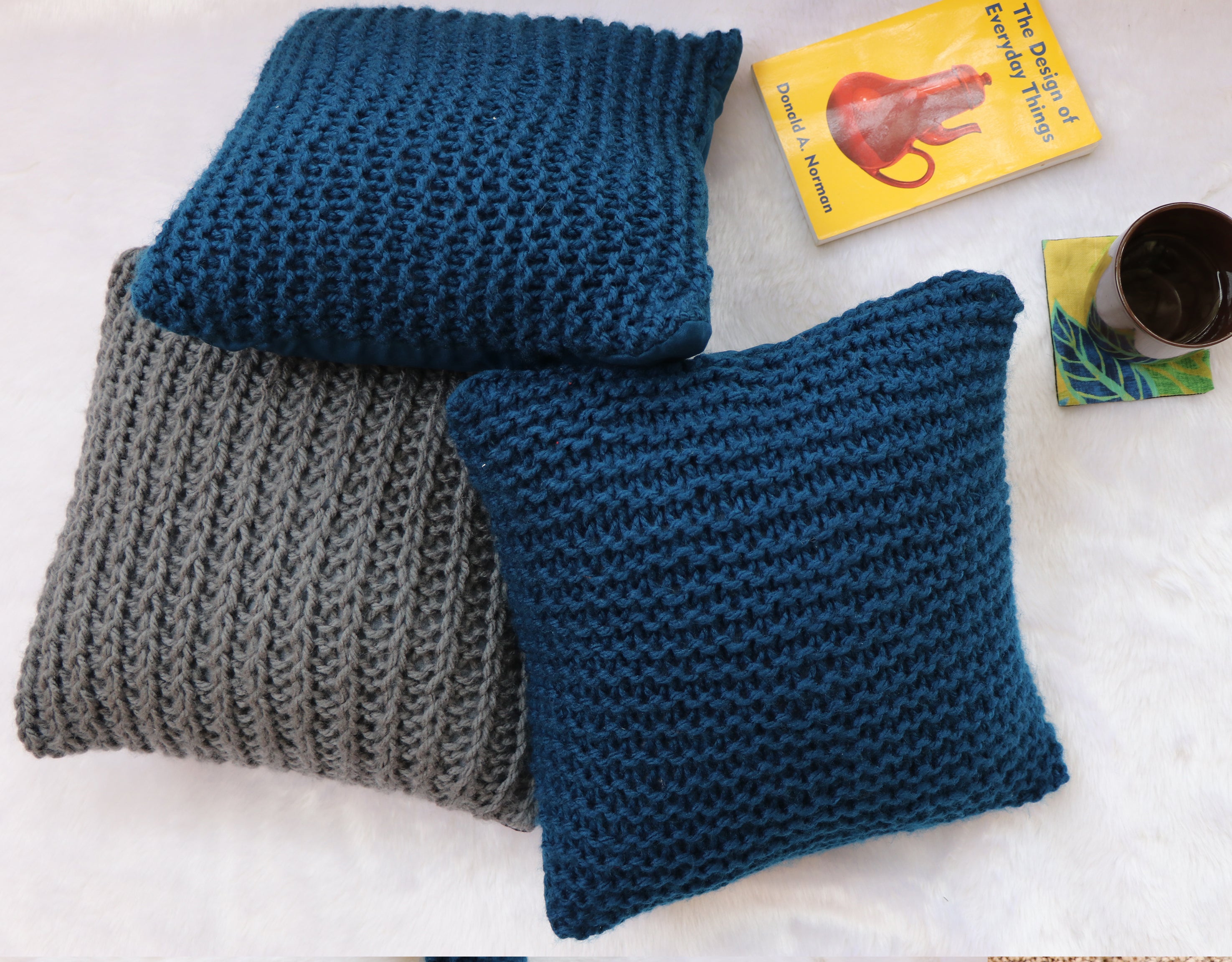 Navy Blue hand knitted cushions by artisans of India for winter season