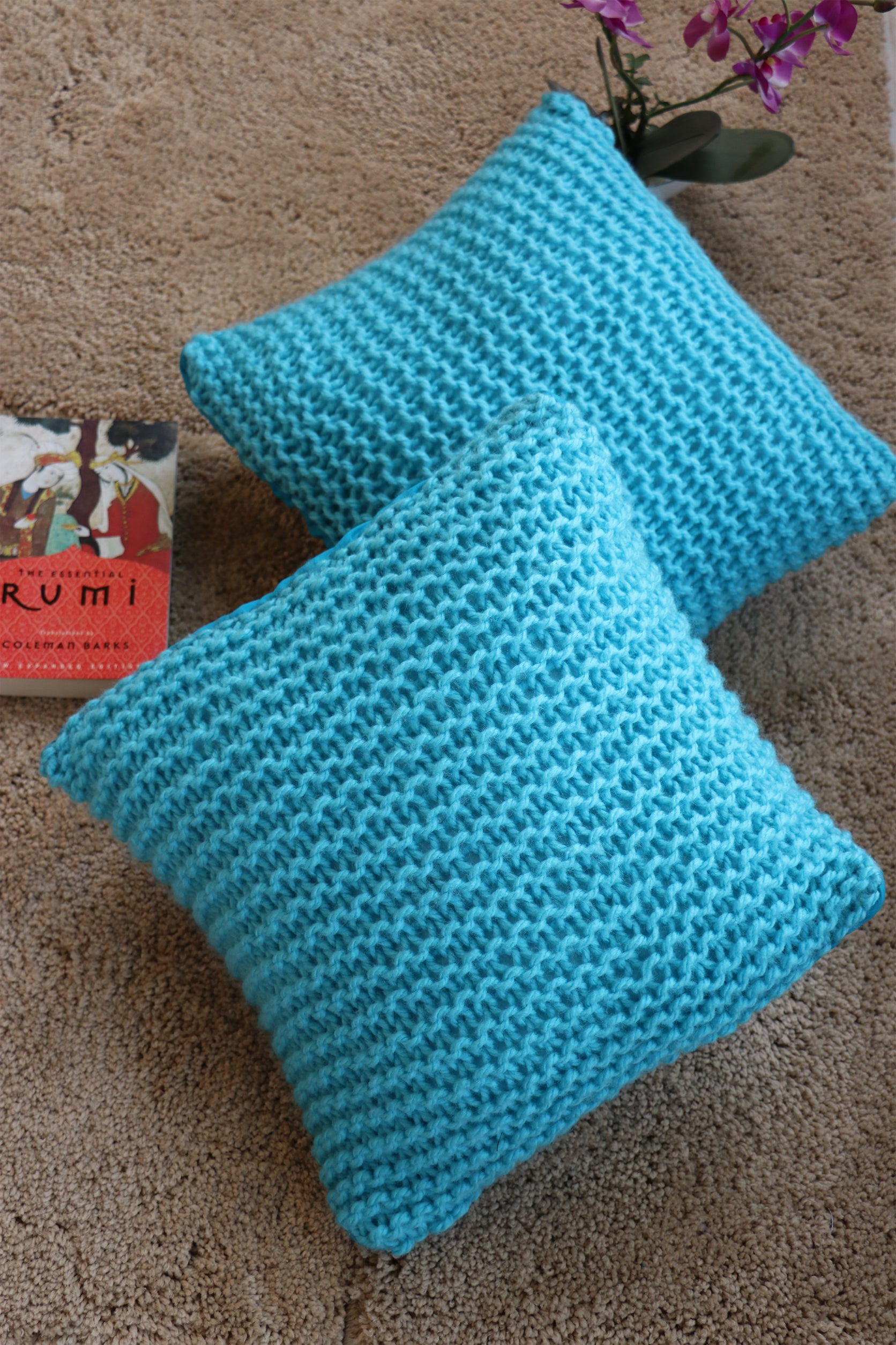 Blue hand knitted cushions by artisans of India for winter season