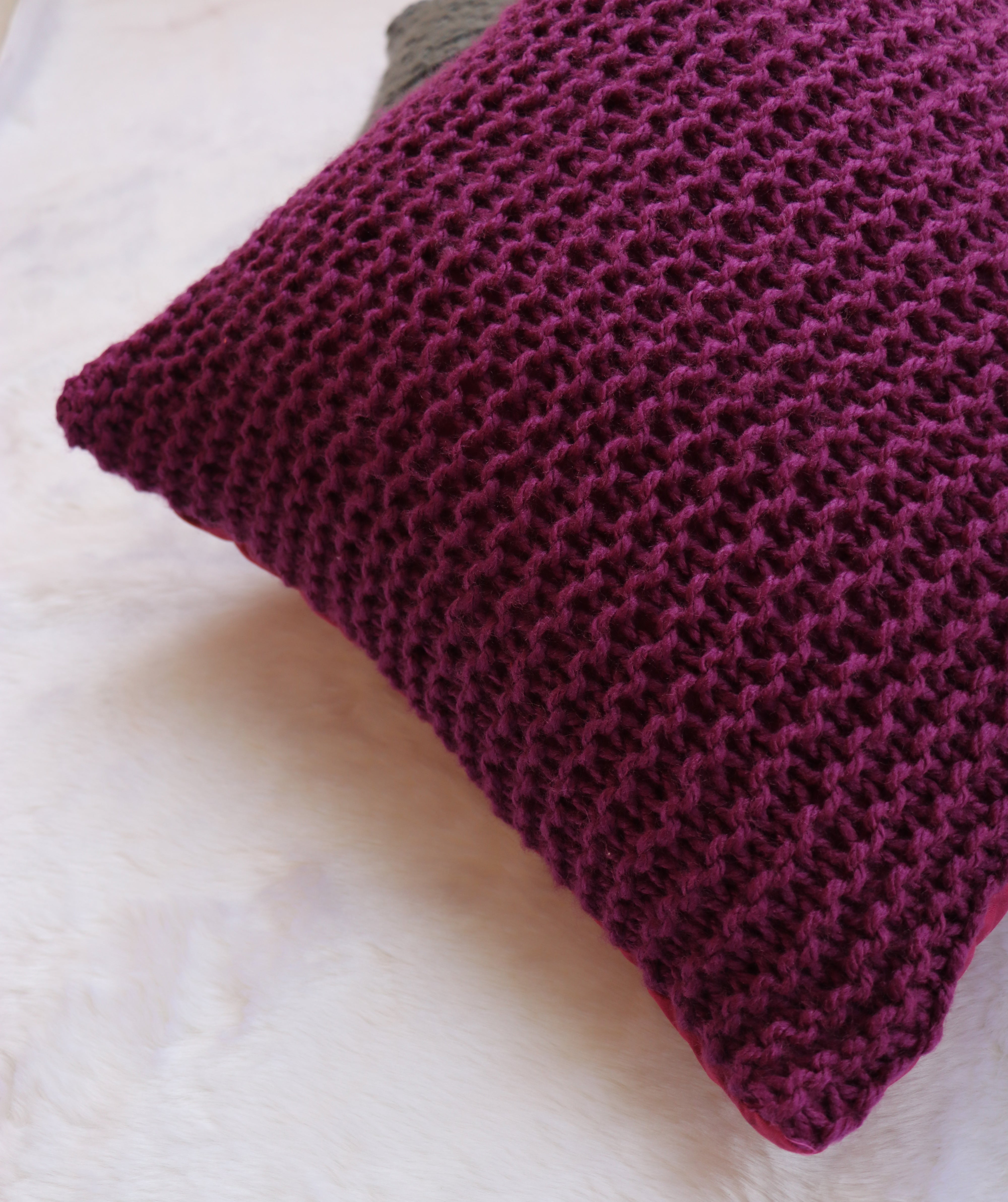 Purple hand knitted cushions by artisans of India for winter season