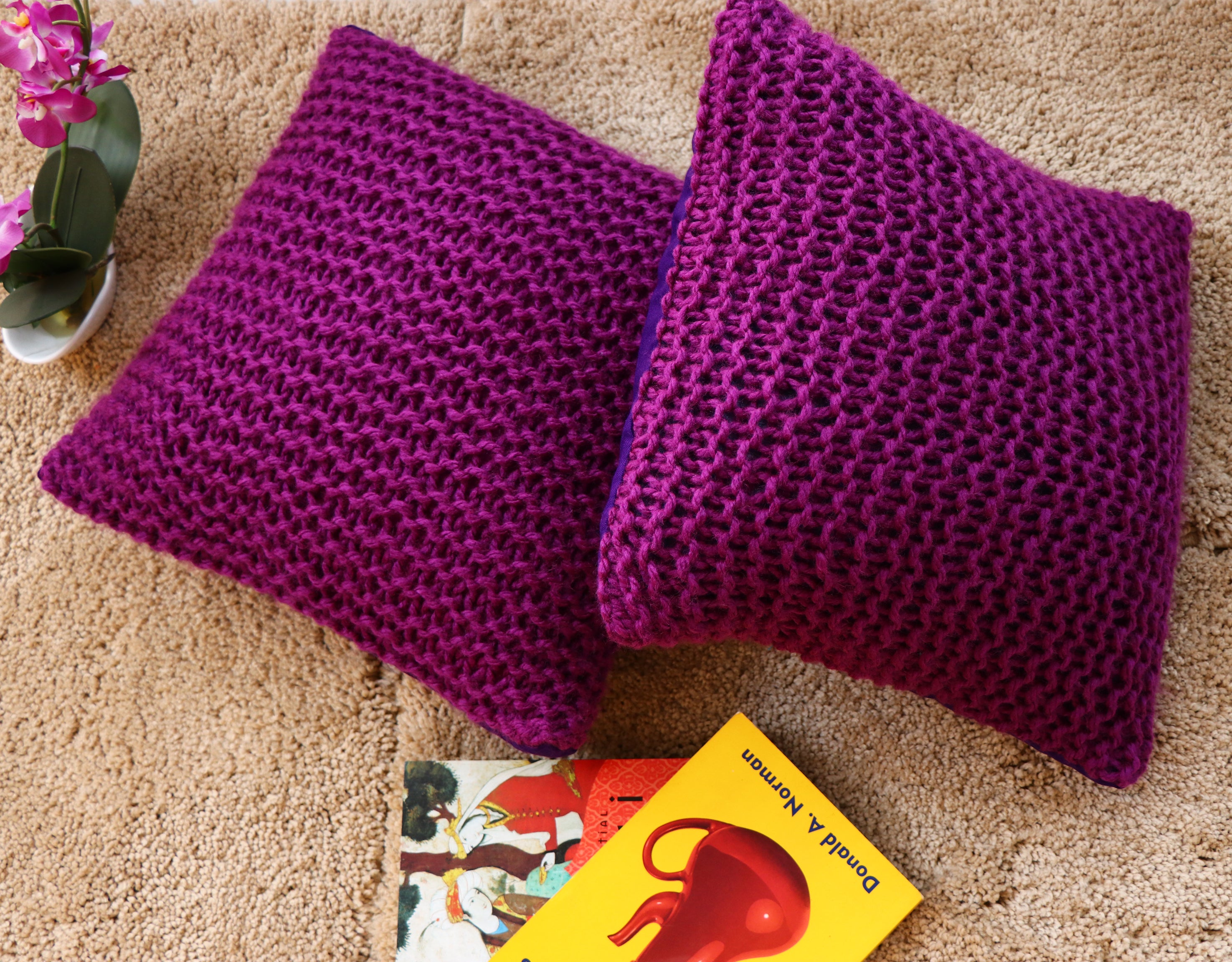 Purple hand knitted cushions by artisans of India for winter season